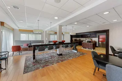 a living room with a ping pong table and chairs at Hampton Inn Nanuet in Nanuet