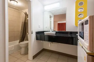 a bathroom with a sink and a toilet at Motel 6-Schenectady, NY in Schenectady