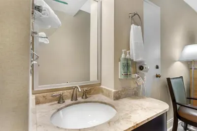 a bathroom with a sink and a mirror at Best Western Queens Gold Coast in Queens