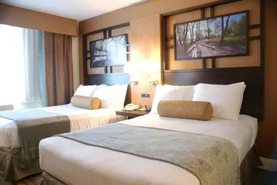 a hotel room with two beds and a window at Best Western Queens Gold Coast in Queens