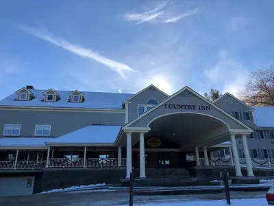 a building with a county inn sign on it at Jiminy Peak Mountain Resort in Hancock