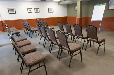 a group of chairs in a room with a whiteboard at Jiminy Peak Mountain Resort in Hancock