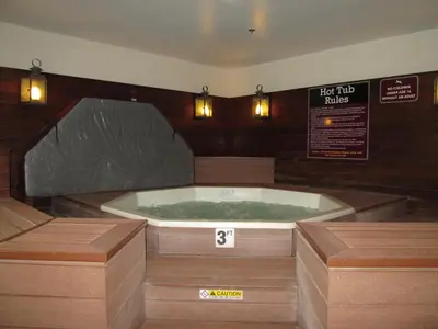 a jacuzzi tub in a room with two lights at Jiminy Peak Mountain Resort in Hancock