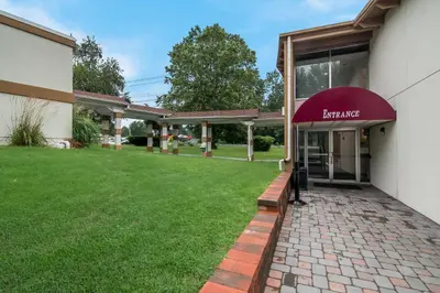 an entrance to a building with a red awning at Quality Inn Westfield - Springfield in Westfield