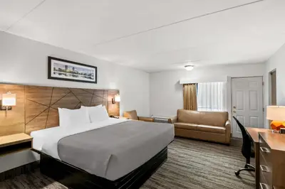 a hotel room with a bed and a desk at Quality Inn Westfield - Springfield in Westfield