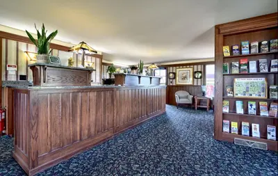 a bar in a hotel room with a counter at Roosevelt Inn & Suites Saratoga Springs in Saratoga Springs