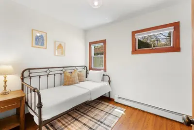 a bedroom with a bed and a window at Phoenicia Lodge in Phoenicia
