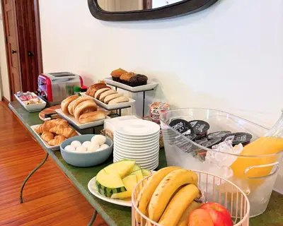 a table topped with lots of different types of food at Phoenicia Lodge in Phoenicia