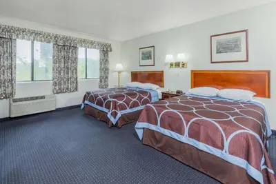 a hotel room with two beds and a window at Super 8 by Wyndham Hartford in Hartford