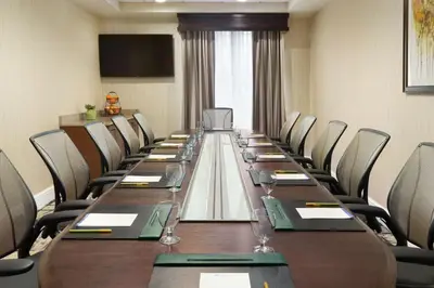 a conference room with a long table and chairs at Hilton Garden Inn Shelton in Shelton