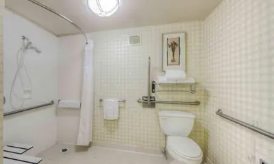 a bathroom with a white toilet and a shower at Hilton Garden Inn Shelton in Shelton