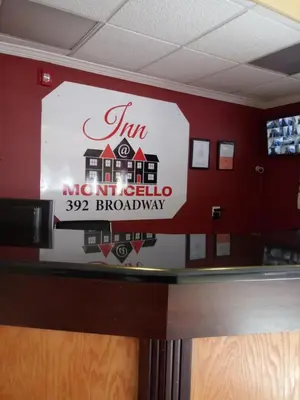 a sign for the front desk of a restaurant at Inn at Monticello in Monticello