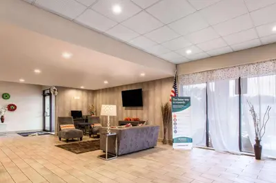 an office with a lobby with a desk and a tv at Quality Inn West Springfield in West Springfield