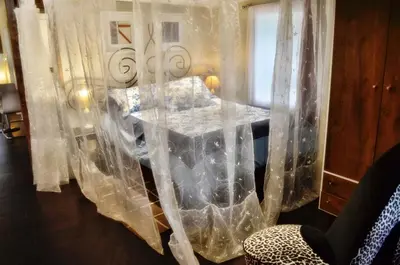 a room with a bed covered in plastic at Romantic, Magical Cottage in Catskills nr Woodstock in Willow