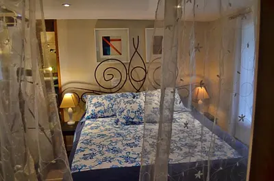 a bedroom with a bed with a canopy at Romantic, Magical Cottage in Catskills nr Woodstock in Willow