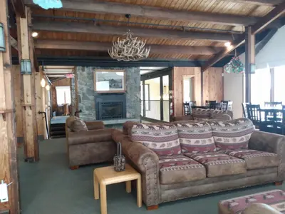 a large living room with couches and a fireplace at Mountain Retreat in Wilmington