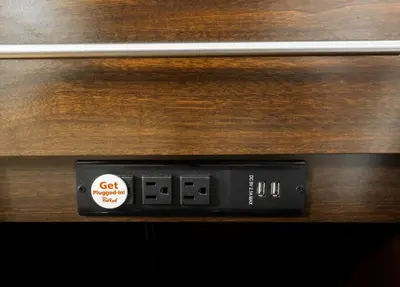 a close up of a clock on a wooden table at Red Roof Inn PLUS+ South Deerfield - Amherst in South Deerfield