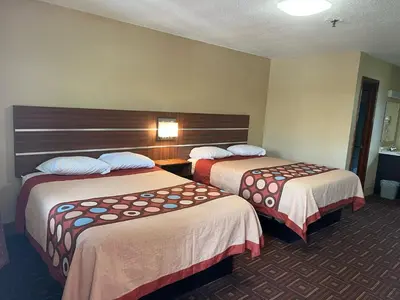 a hotel room with two beds in a room at American Inn in Branford