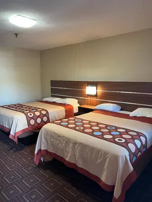 a hotel room with two beds in a room at American Inn in Branford