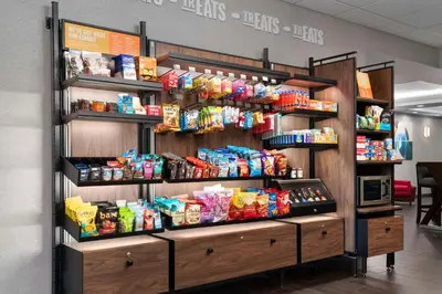 a store display with food and snacks on shelves at Hampton Inn Chicopee - Springfield in Chicopee