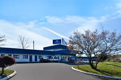 a gas station with a car parked in front of it at Best Stay Inn -Manchester in Manchester