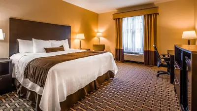 a hotel room with a large bed and a window at Best Western Plus The Inn & Suites at the Falls in Poughkeepsie