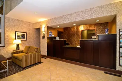 a hotel lobby with a waiting area and a waiting room at Best Western Plus The Inn & Suites at the Falls in Poughkeepsie