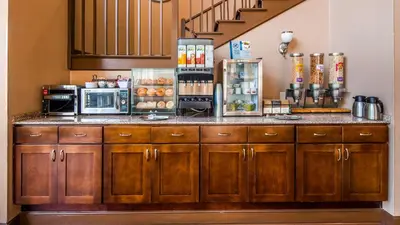 a kitchen with a counter with aasteryasteryasteryasteryasteryasteryasteryasteryastery at Best Western Plus The Inn & Suites at the Falls in Poughkeepsie
