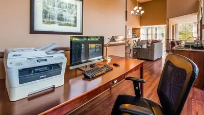 an office with a computer on a wooden desk at Best Western Plus The Inn & Suites at the Falls in Poughkeepsie