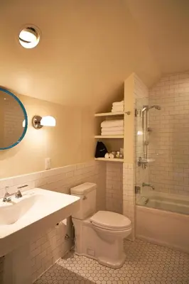 a bathroom with a toilet and a sink and a shower at Troutbeck in Amenia