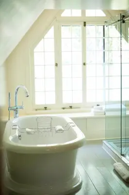 a bath tub in a bathroom with a window at Troutbeck in Amenia