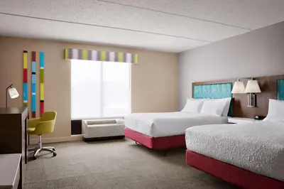 a hotel room with two beds and a window at Hampton Inn & Suites West Haven in West Haven