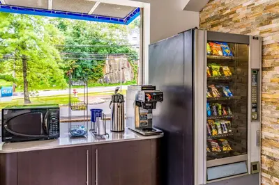 a kitchen with a microwave and a refrigerator at Motel 6-Elmsford, NY - White Plains in Elmsford