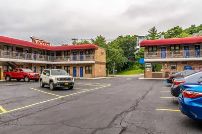 a parking lot in front of a hotel at Motel 6-Elmsford, NY - White Plains in Elmsford