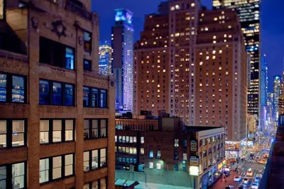 a view of a city at night with tall buildings at TownePlace Suites by Marriott New York Manhattan/Times Square in New York