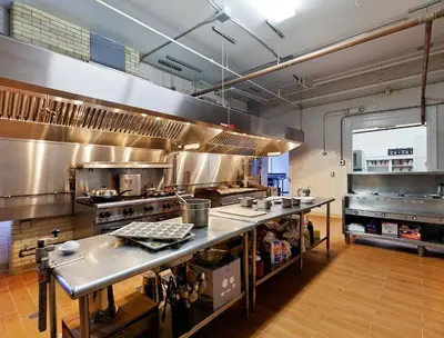 a large kitchen with stainless steel counters in a kitchen at Eastover Estate and Eco Village in Lenox