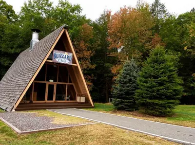 a building with a sign on top of it at Cove Haven Resort in Lakeville