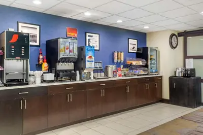 a coffee shop with a counter and aperature at Best Western Plus Berkshire Hills Inn & Suites in Pittsfield