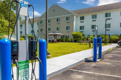 a row of parking meters in front of a building at Best Western Plus Berkshire Hills Inn & Suites in Pittsfield