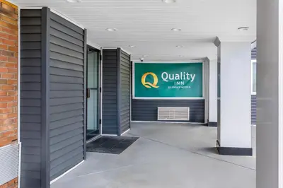 a building with aania sign on the wall at Quality Inn in West Haven