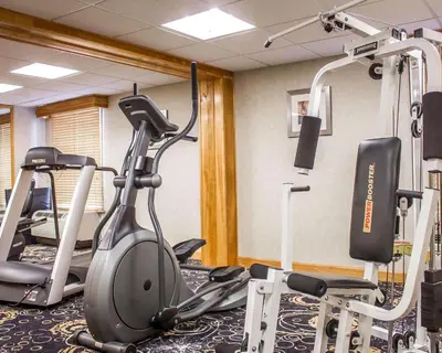 a gym with several exercise bikes and tread machines at Comfort Inn Wethersfield - Hartford in Wethersfield