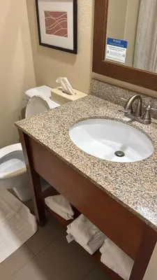 a bathroom with a sink and a toilet at Comfort Inn Wethersfield - Hartford in Wethersfield