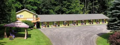 a house with a driveway in front of it at Starlite Motel & Suites in Big Indian