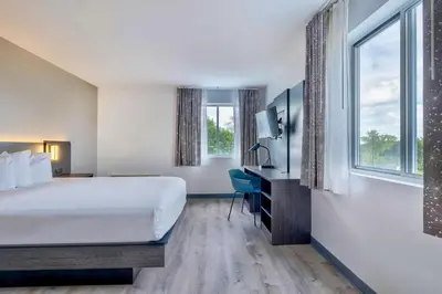 a hotel room with a bed and a tv at Motel 6 Bethel, CT - Danbury in Bethel