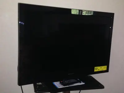 a computer monitor on a stand with a remote control at FairBridge Inn Express Milford in Milford