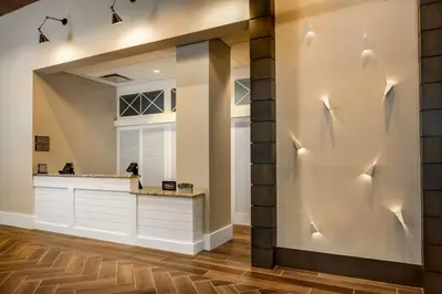 a large mirror in a living room with a counter at Homewood Suites By Hilton Teaneck Glenpointe in Teaneck
