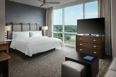 a bedroom with a bed and a flat screen tv at Homewood Suites By Hilton Teaneck Glenpointe in Teaneck