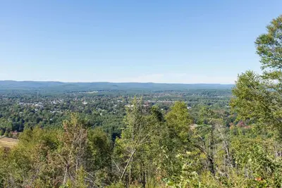 a view from the top of a hill with trees at Knights Inn Hadley in Hadley