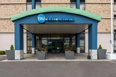 a building with a blue best western sign on it at Best Western Executive Hotel New Haven-West Haven in West Haven