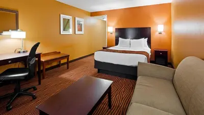 a hotel room with a bed and a desk at Best Western Executive Hotel New Haven-West Haven in West Haven